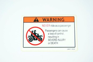 NAKLEJKA OSTRZEGAWCZA 87560-LBA7-E00 Kymco 87560-LBA7-E00